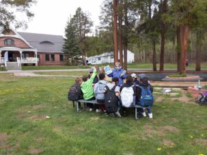 Pb Swims Board member, Elaine Kent, teaches swim safety to Lake County kids at the Leadville National Fish Hatchery.